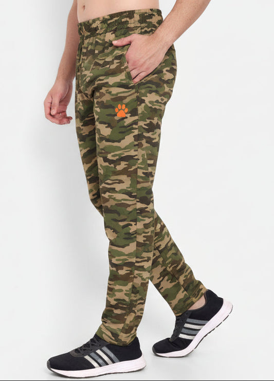 Person wearing green athletic pants with a brand logo on a white background