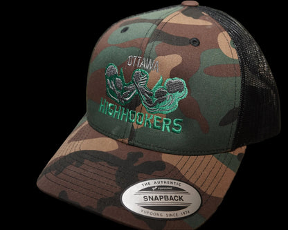 A camouflage snapback trucker hat