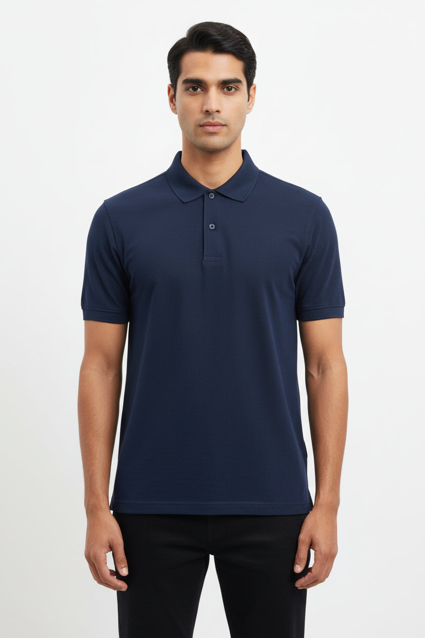 Navy blue polo shirt on a hanger against a beige background