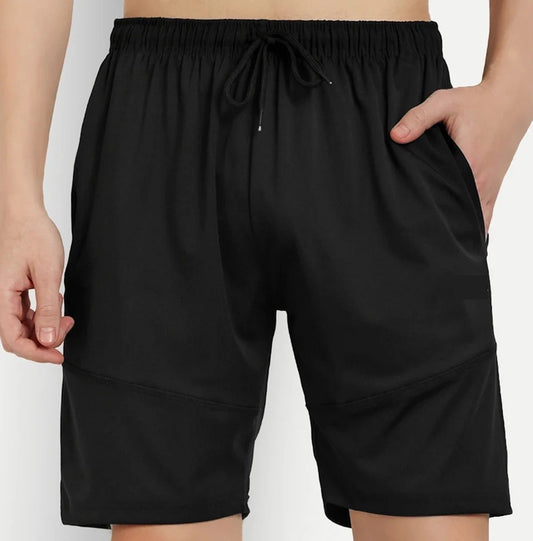Black shorts worn by a person on a white background