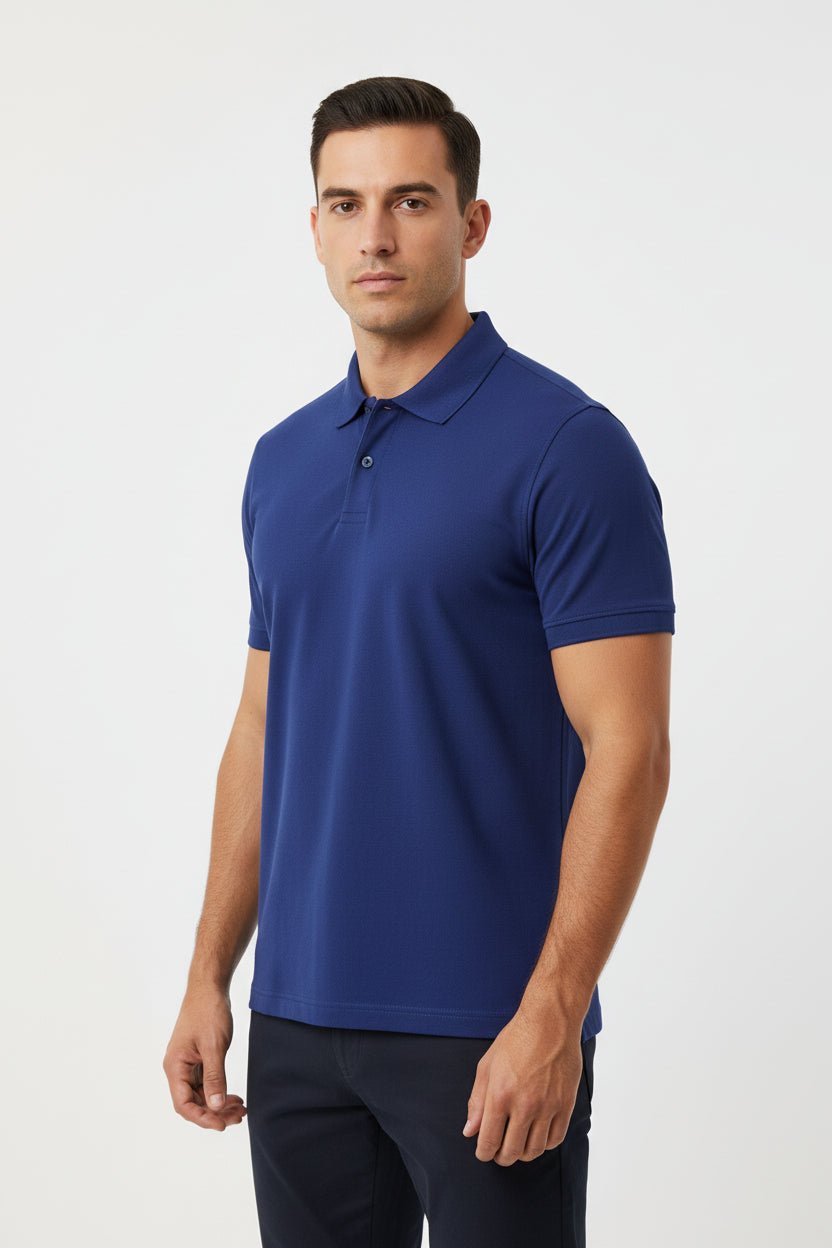 Blue polo shirt on a hanger against a beige background