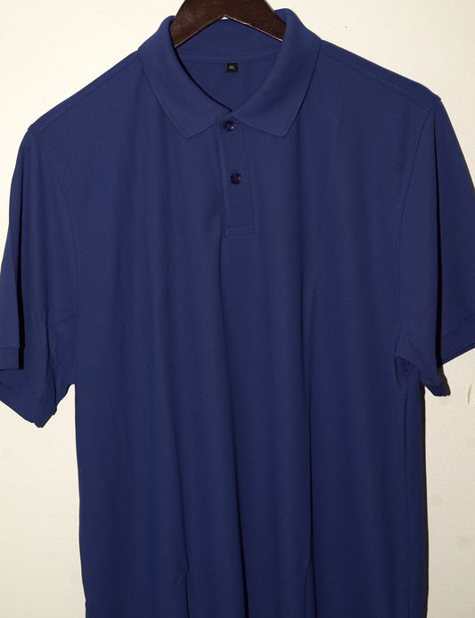 Blue polo shirt on a hanger against a beige background